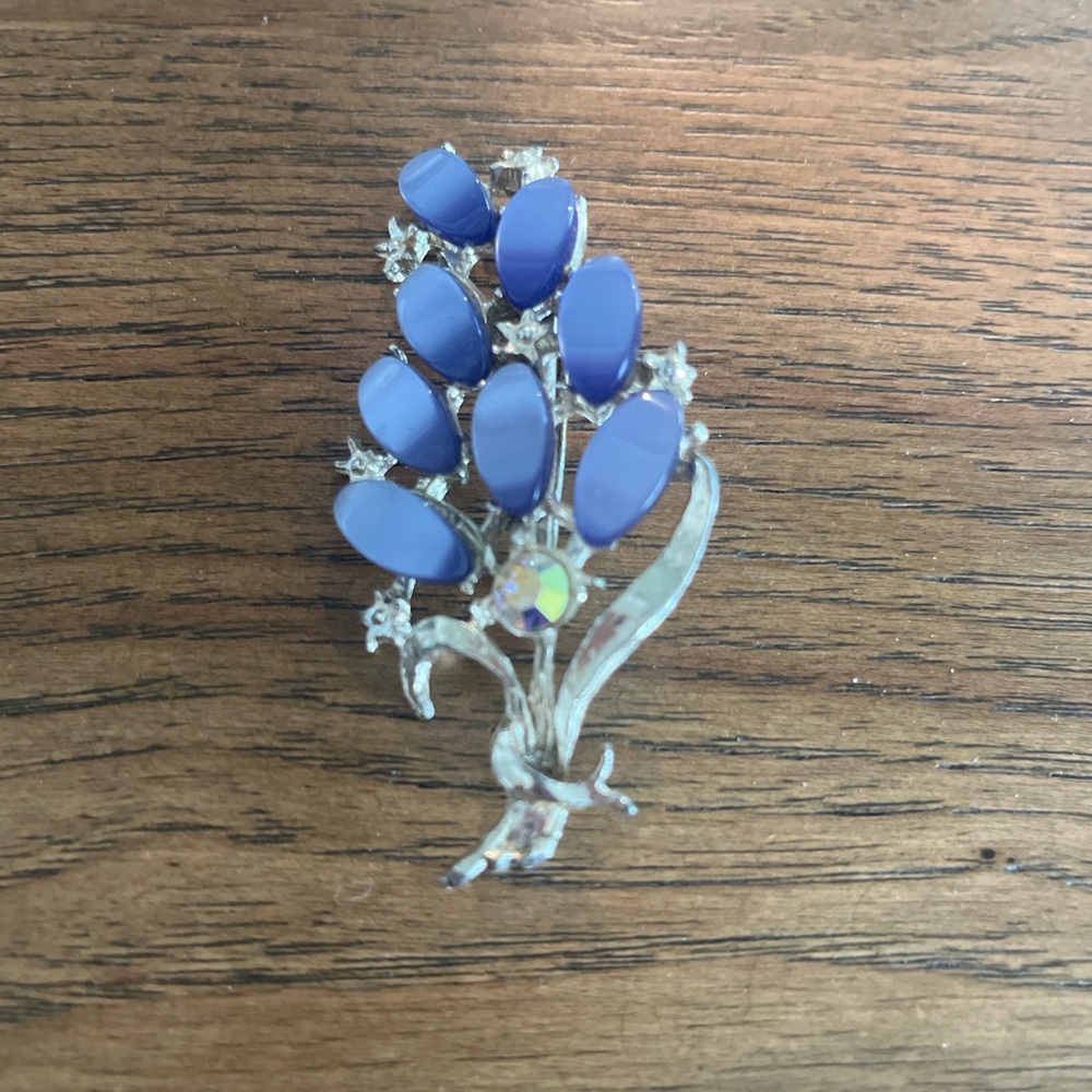 Vintage floral brooch with blue opaque cabochon stones.
